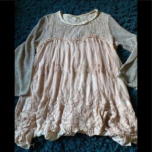 Beautiful pink layered look sweater.